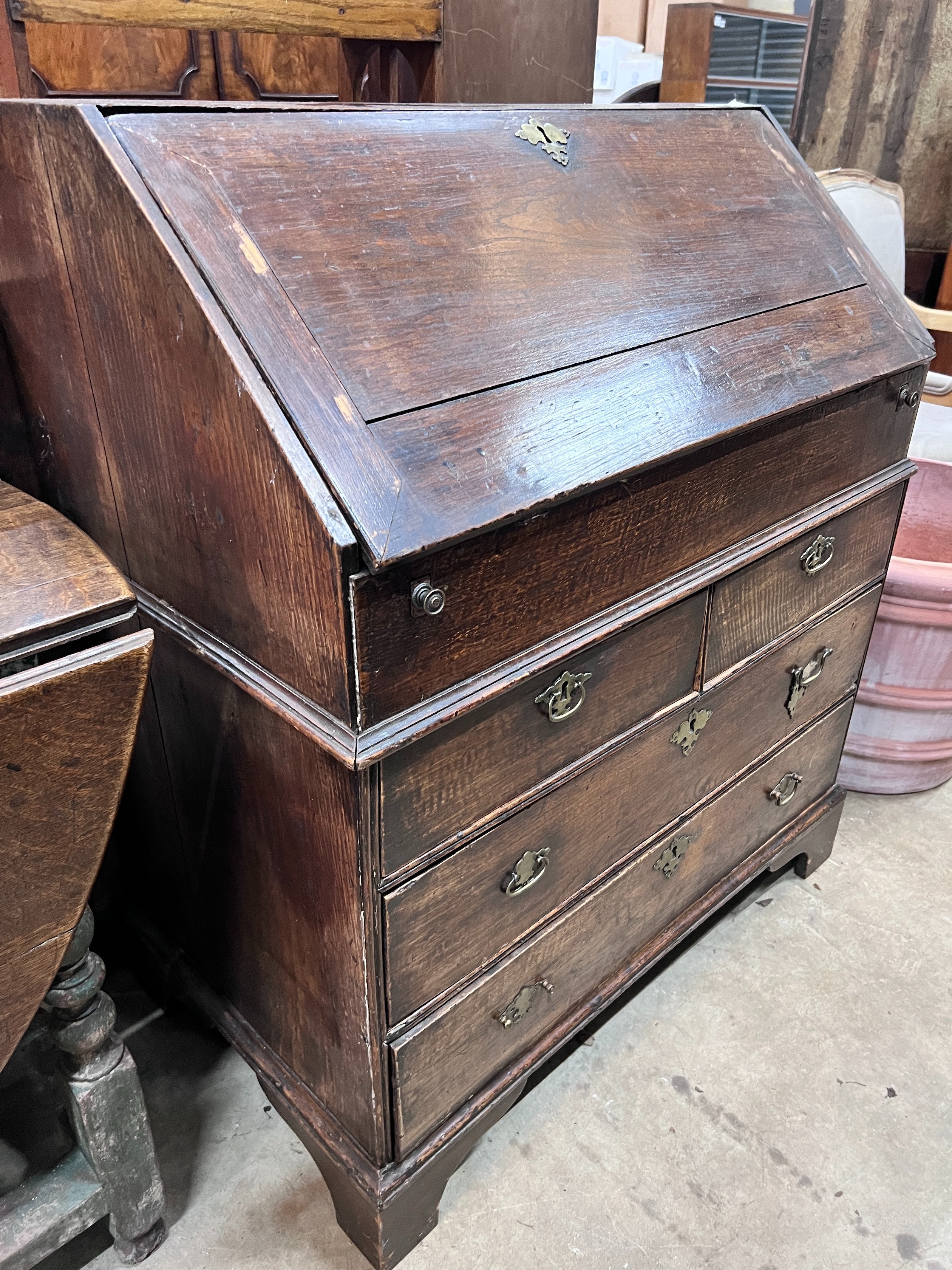 An 18th century oak bureau, width 86cm, depth 50cm, height 102cm *Please note the sale commences at 9am.